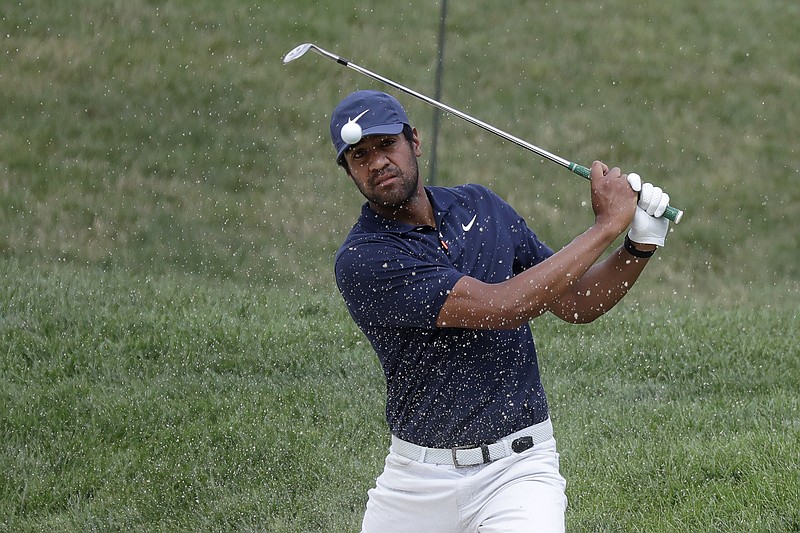 AP photo by Darron Cummings / Tony Finau hits from a bunker toward the 14th green at Muirfield Village Golf Club during the first round of the Memorial Tournament on Thursday in Dublin, Ohio. Finau shot a 65 and held a one-stroke lead.