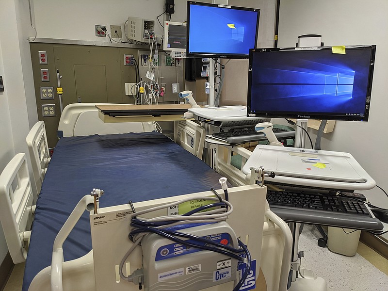 FILE - In this Thursday, April 9, 2020, photo, a patient care room is reconditioned for use during the coronavirus pandemic at the St. Vincent Medical Center building in Los Angeles. The empty hospital near downtown Los Angeles is being leased by the State of California to operate as a healthcare facility during the COVID-19 outbreak in Los Angeles County. (AP Photo/Damian Dovarganes, File)


