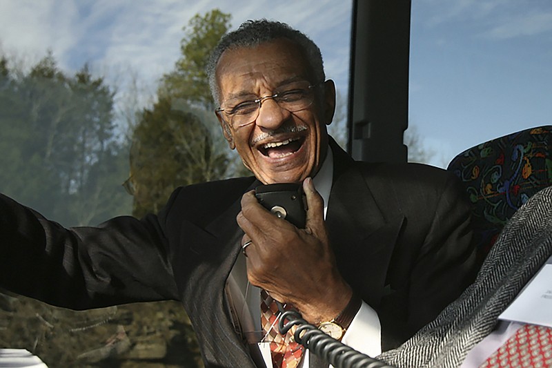 In this Jan. 27, 2007, file photo, C.T. Vivian uses an intercom with Rev. James Lawson on a bus in Montgomery, Ala., to discuss the experiences they encountered in 1961 as Freedom Riders, a group of college students who defied segregation on interstate buses across the American South. The Rev. Vivian, a civil rights veteran who worked alongside the Rev. Martin Luther King Jr. and served as head of the organization co-founded by the civil rights icon, has died at home in Atlanta of natural causes Friday morning, July 17, 2020 his friend and business partner Don Rivers confirmed to The Associated Press. Vivian was 95. (Lavondia Majors/The Tennessean via AP)