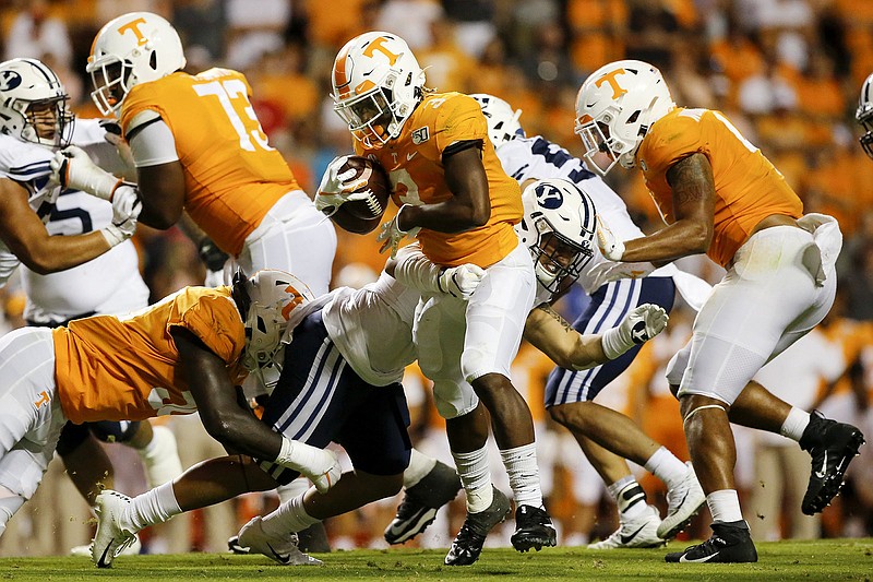 Staff photo by C.B. Schmelter / Tennessee running back Eric Gray breaks away from BYU linebacker Jackson Kaufusi on Sept. 7, 2019, at Neyland Stadium.