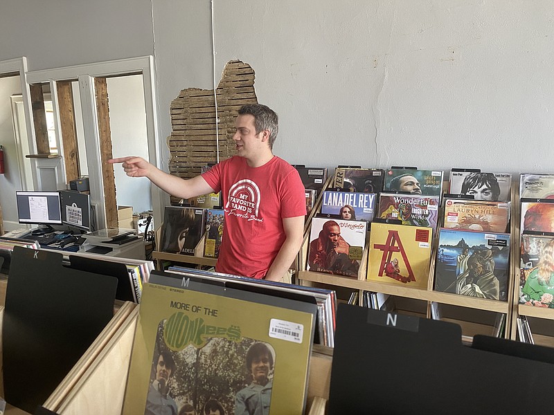 Photos by Barry Courter / Ben VanderHart looks over part of his inventory at Yellow Racker Records on Main Street.