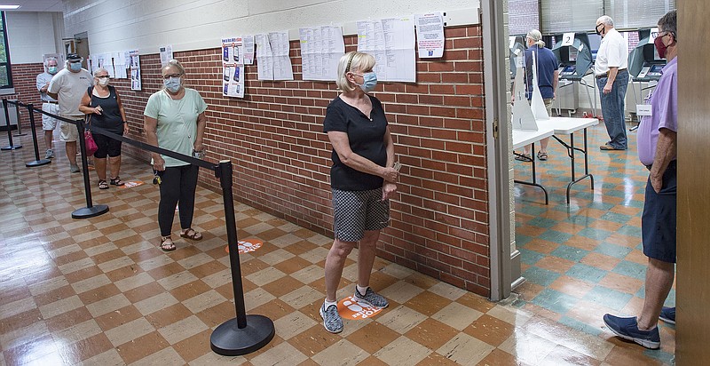 Voters stand apart as they wait to cast ballots during early voting in the state's primary elections, Friday morning, July 17, 2020, in Bristol, Tenn. (Andre Teague/Bristol Herald Courier via AP)


