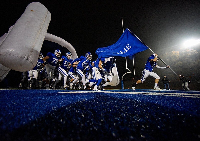 Photo by Cade Deakin / McCallie football players run onto the field before a home playoff game against Ensworth Tigers last Nov. 22.