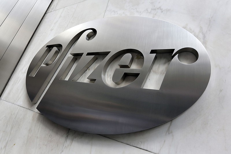 File- This Dec. 4, 2017, photo shows the Pfizer company logo at the company's headquarters in New York. The federal government has agreed to pay nearly $2 billion for 100 million doses of a potential COVID-19 vaccine being developed by the U.S. drugmaker and its German partner BioNTech. (AP Photo/Richard Drew, File)


