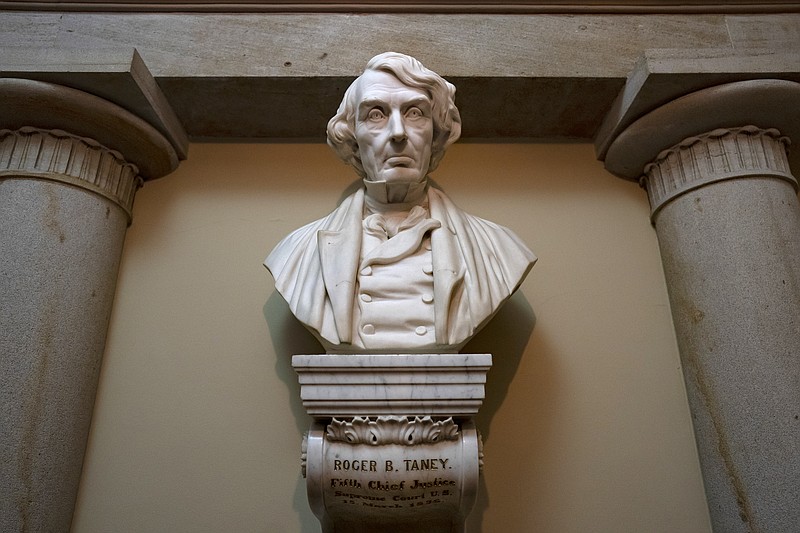 FILE - In this March 9, 2020 file photo, a marble bust of Chief Justice Roger Taney is displayed in the Old Supreme Court Chamber in the U.S. Capitol in Washington. The House will vote on whether to remove from the U.S. Capitol a bust of Chief Justice Roger B. Taney, the author of the 1857 Dred Scott decision that declared African Americans couldn't be citizens. The vote expected Wednesday comes as communities nationwide reexamine the people memorialized with statues. (AP Photo/J. Scott Applewhite)


