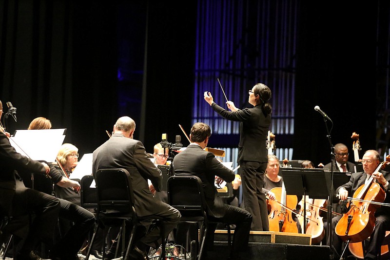 Staff file photo / Music Director Kayoko Dan conducts the Chattanooga Symphony & Opera during the 2019 Veterans Day concert at Soldiers and Sailors Memorial Auditorium. The CSO is changing how it presents performances this year due to safety concerns associated with the coronavirus pandemic.