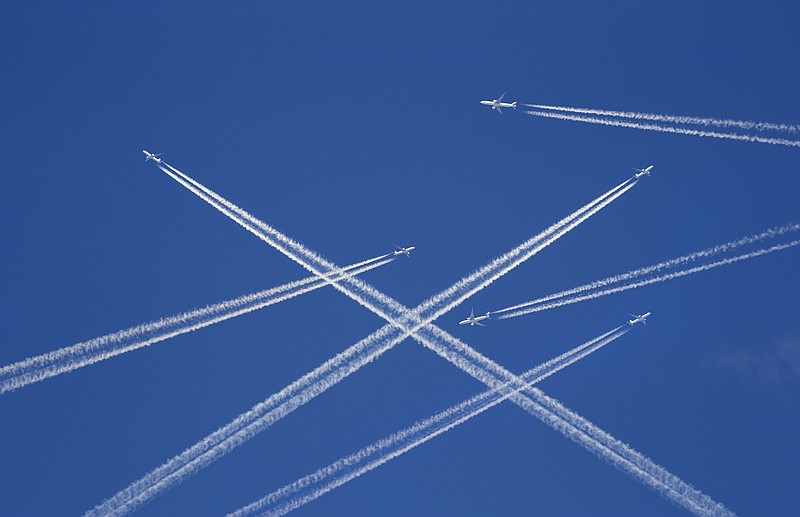 A lot of passenger airplanes on the air, busy air traffic, traveling high season starts concept. White planes against blue sky. Photo manipulation. - stock photo plane tile sky tile planes skies flying flight tile / Getty Images
