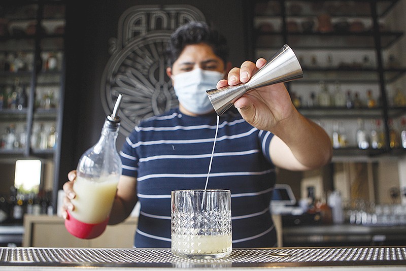 Staff photo by C.B. Schmelter / Jorge Parra mixes up a Paloma during a photo shoot at Taqueria Jalicso - Ania on Wednesday, June 17, 2020 in Chattanooga, Tenn.