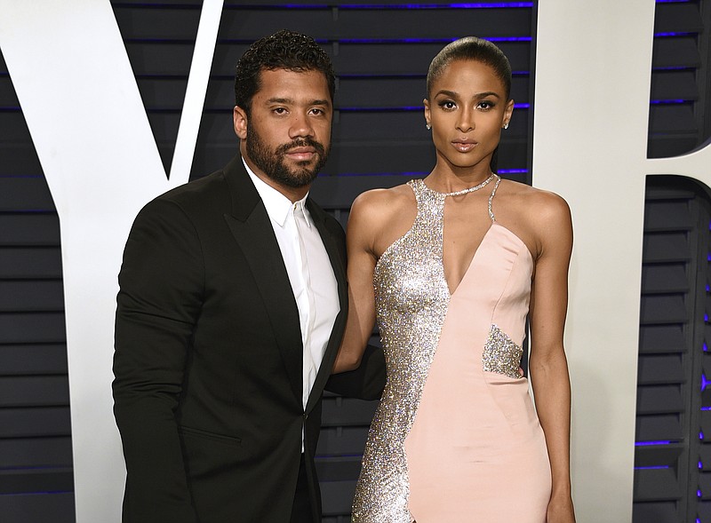 Russell Wilson, left, and Ciara arrive at the Vanity Fair Oscar Party in Beverly Hills, Calif. on Feb. 24, 2019. Wilson and his pop star wife Ciara are now parents to a baby boy. The couple announced Friday the birth of their son named Win Harrison Wilson on Instagram. (Photo by Evan Agostini/Invision/AP, File)