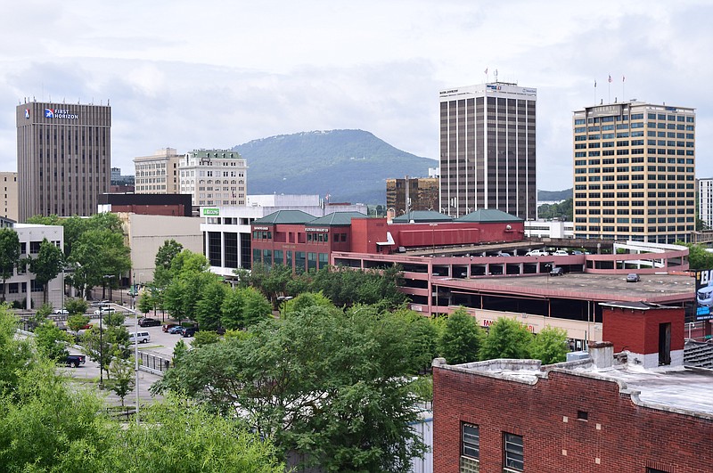 Lookout Mountain serves as the backdrop for this view of Downtown Chattanooga in this view from the Unum parking garage.  Major landmarks are, from left, First Horizon Bank, the James Building, the Maclellan Building, Regions Bank, Market Court (home to Raymond James and Fletcher Bright), The Westin, Republic Centre, and the Liberty Tower. / Staff Photo by Robin Rudd  