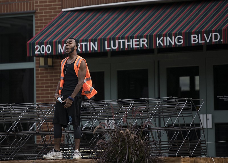 Staff photo by Troy Stolt / Protester Lebron Nash leads a chant in front of the Bessie Smith Cultural Center during the Chattanooga Workers for Black Lives: Rally, Stories and March on Saturday, July 25, 2020 in Chattanooga, Tenn.