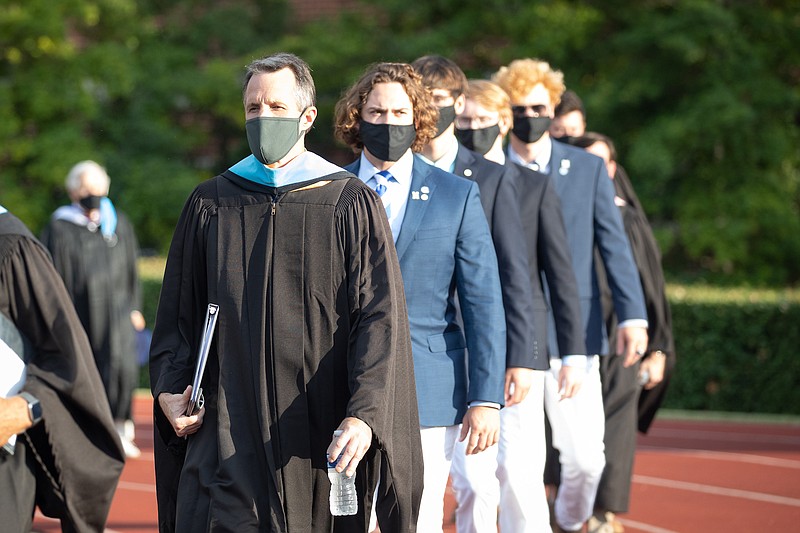 Contributed Photo - Sumner McCallie, Dean of Faculty and Curriculum, leading the graduates into the stadium; behind him is Gus Buck from Jacksonville, Florida, co-salutatorian and recipient of the Grayson Medal.