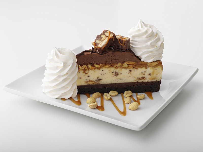 Photo from The Cheesecake Factory/ The Cheesecake Factory will debut Chocolate Caramelicious Cheesecake Made With Snickers on National Cheesecake Day, Thursday, July 30. It's made with the chain's original cheesecake swirled with Snickers on a brownie crust with chocolate, caramel and peanuts.