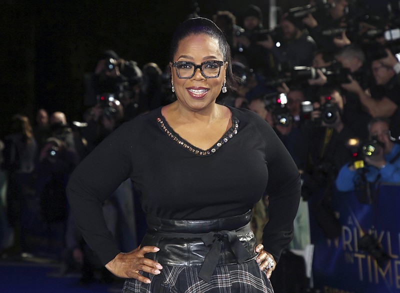 FILE - In this March 13, 2018, file photo, actress Oprah Winfrey poses for photographers upon arrival at the premiere of the film "A Wrinkle In Time" in London. O, The Oprah Magazine is ending its regular monthly print editions with the December 2020 issue after 20 years of publication. The brand, which is among the most recognizable magazines in the U.S., is not going away but will become more "more digitally-centric," said a Hearst spokeswoman Monday. (Photo by Joel C Ryan/Invision/AP, File)