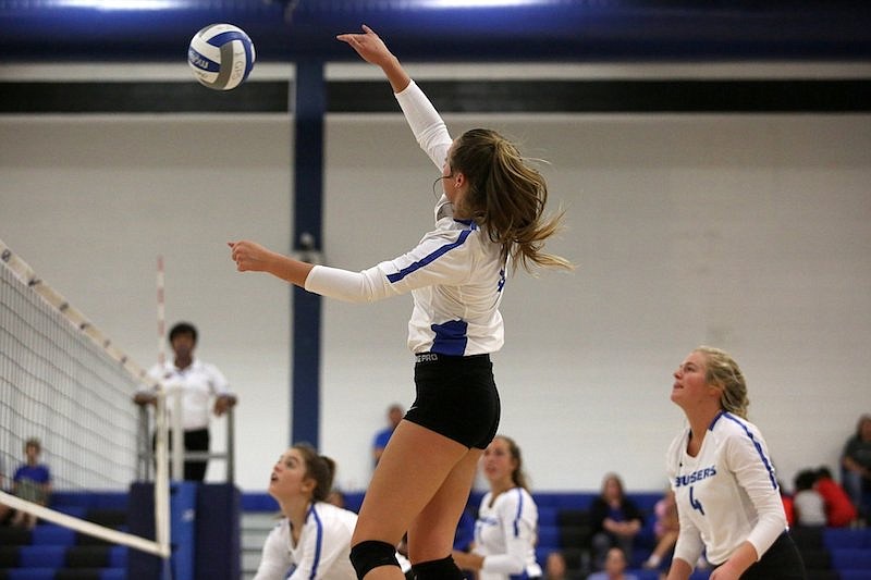 Staff photo / GPS volleyball player Chapel Cunningham hits the ball over the net during a home match against East Hamilton on Sept. 25, 2019.