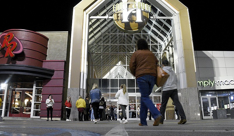 Staff File Photo by Robin Rudd/ At Black Friday shopping in November 2019, shoppers head toward the food court entrance at Hamilton Place mall during more robust times for CBL Properties, which is renegotiating its debt after the closing of many of its retail tenants.