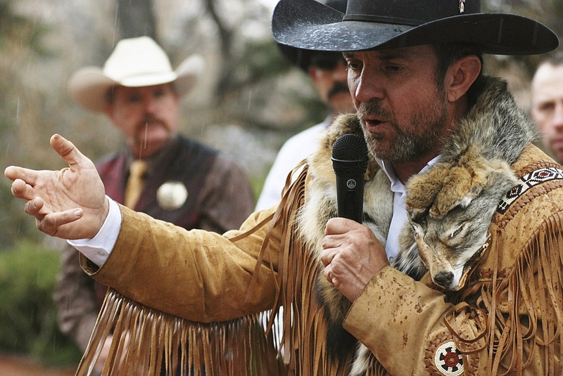 FILE - In this March 12, 2019, file photo, Otero County Commissioner and Cowboys for Trump founder Coy Griffin denounces gun control and pro-abortion rights bills in the New Mexico State Legislature at a protest outside the Statehouse in Santa Fe, N.M. The group said this week seek arbitration in a fight with the New Mexico Secretary of State over fines and required reports. (AP Photo/Morgan Lee, File)