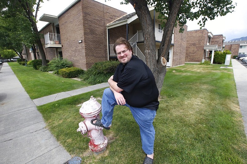 Christian Haskins, 37, is shown at his home Thursday, July 23, 2020, in Millcreek, Utah. He was laid off from his job as a labor coordinator for live events in July. Without the $600-a-week federal enhancement to his unemployment, he'll be barely scraping by and he's scared of what could happen if he has a costly emergency. (AP Photo/Rick Bowmer)