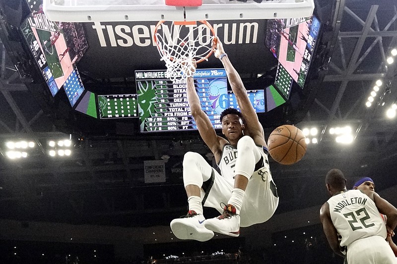 AP file photo by Morry Gash / The Milwaukee Bucks and star Giannis Antetokounmpo sit atop the Eastern Conference standings and lead the NBA in wins, with 53, as 22 of the league's 30 teams return to competition to finish the 2019-20 regular season and set up the playoffs, all of which will be played at the ESPN Wide World of Sports Complex near Orlando, Fla.