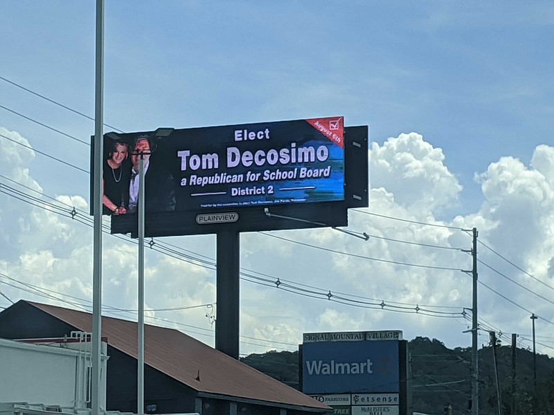 (Photo by Sarah Grace Taylor) District 2 school board candidate Tom Decosmio said he is identifying himself as a Republican in this billboard not running his campaign as one.