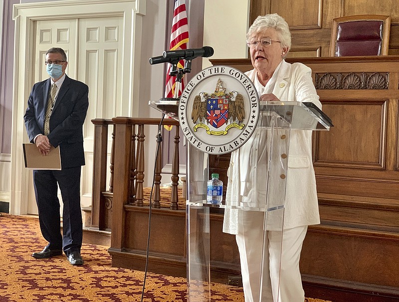 Alabama Gov. Kay Ivey, right, and State Health Officer Scott Harris announce the extension of a state order requiring face masks in public during a press conference, Wednesday, July 29, 2020, in Montgomery, Alabama. Ivey extended a state order requiring face coverings in public for another month and expanded it to include students in grade 2 and above in an attempt to slow the spread of COVID-19 as schools reopen. (AP Photo/Kim Chandler)


