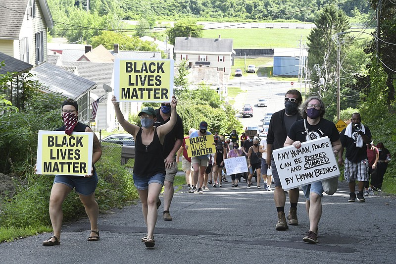 Photo by Gillian Jones of The Berkshire Eagle via The Associated Press / Peaceful protestors march up Tyler Street in North Adams, Massachusetts, during a Black Lives Matter march on July 26, 2020, through the city of North Adams.