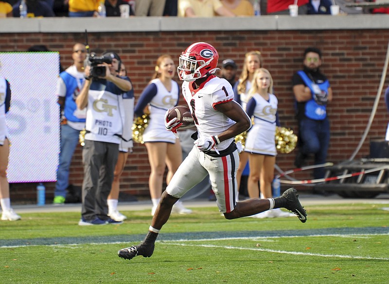 Georgia photo by Al Eckford / Georgia receiver George Pickens scores a touchdown during last November's 52-7 win by the Bulldogs at Georgia Tech. The Bulldogs and Yellow Jackets will not play this season due to the SEC's 10-game league-only schedule.