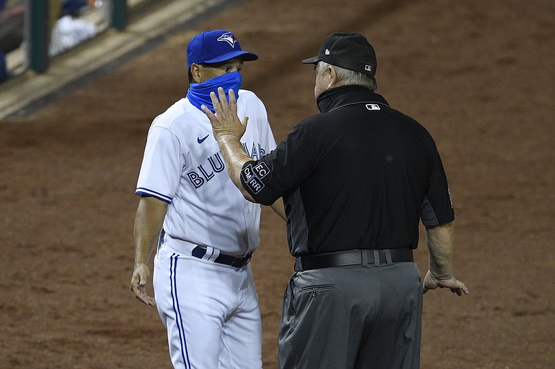 AP photo by Nick Wass / Toronto Blue Jays manager Charlie Montoyo, left, talks with first base umpire Joe West, right, after Rowdy Tellez was ejected during the 10th inning of Wednesday's game against the Washington Nationals in D.C. The Nationals won 4-0.