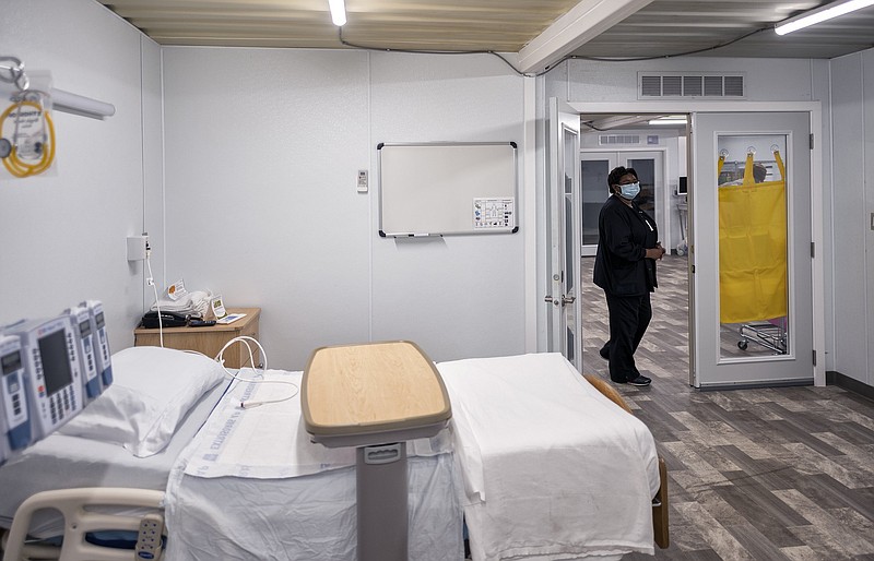 Nurse Manager Betsy Ross inspects a patient room Monday, July 20, 2020, inside the mobile COVID-19 unit at the Northeast Georgia Medical Center in Gainesville, Ga. The unit, constructed from modular buildings by the Georgia Emergency Management and Homeland Security Agency went into operation Tuesday, July 21, 2020, amid high numbers of COVID-19 hospitalizations across the state. (Scott Rogers/The Gainesville Times via AP)


