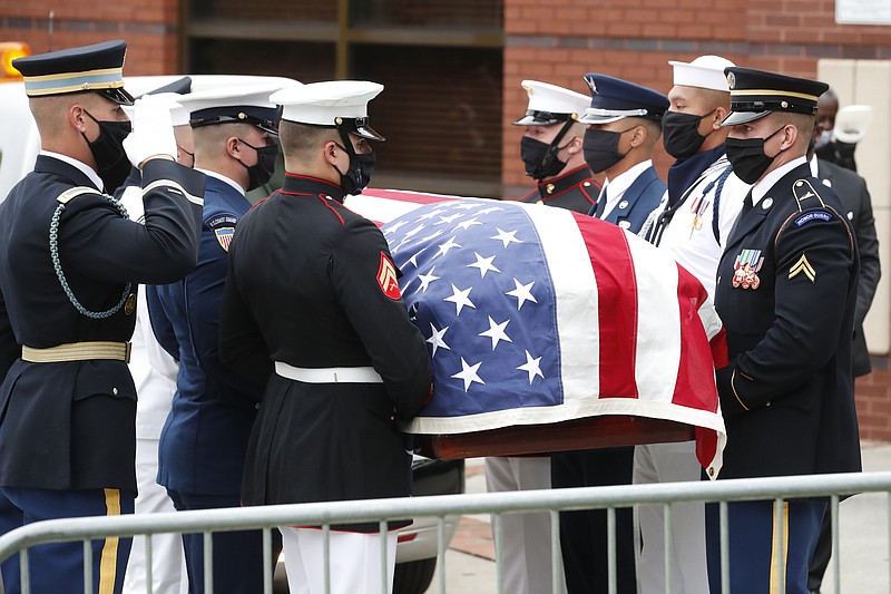 A military honor guard moved the casket of Rep. John Lewis into Ebenezer Baptist Church for his funeral, Thursday, July 30, 2020, in Atlanta. Lewis, who carried the struggle against racial discrimination from Southern battlegrounds of the 1960s to the halls of Congress, died Friday, July 17, 2020. (AP Photo/John Bazemore)