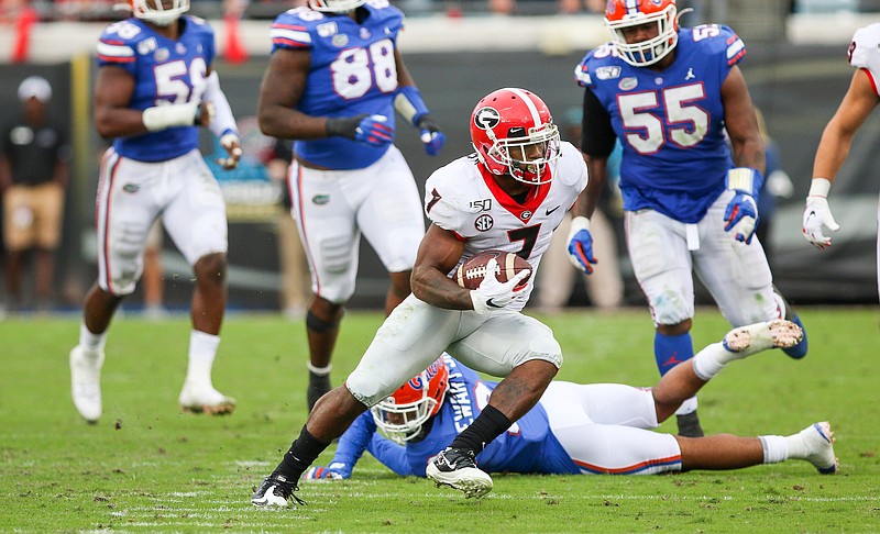 Georgia photo by Chamberlain Smith / Georgia running back D'Andre Swift looks to the open field during last season's 24-17 win over Florida in Jacksonville.