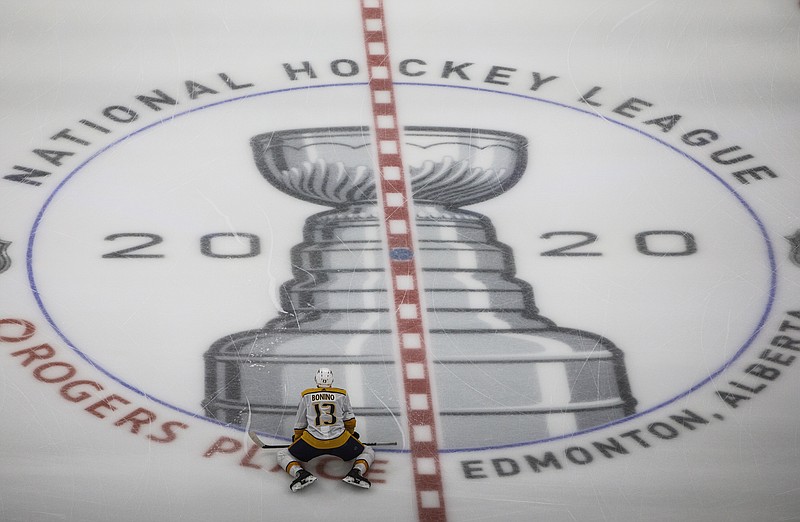 AP photo by Jason Franson / Nashville Predators center Nick Bonino stretches before an NHL exhibition game against the Dallas Stars on Thursday in Edmonton, one of two Canadian cities, along with Toronto, that will host the league's return to play.