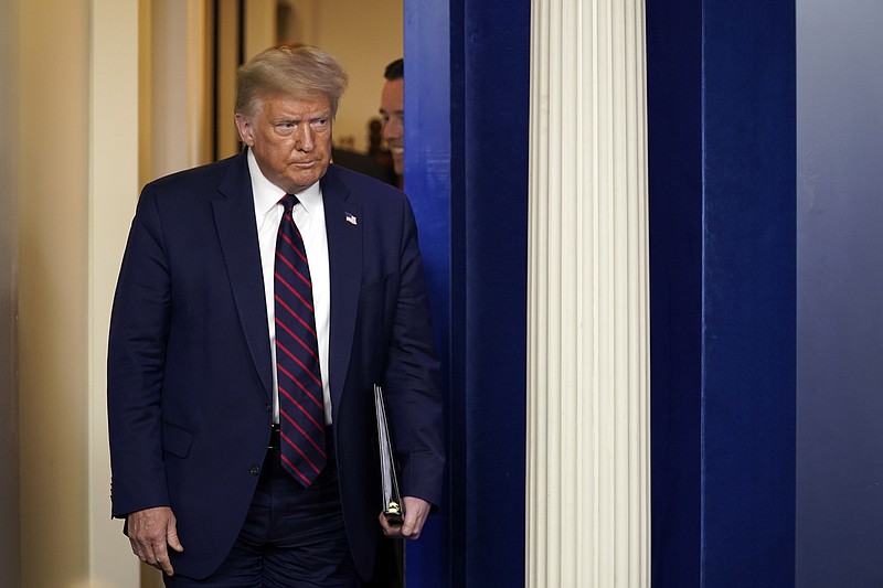 President Donald Trump arrives to speak at a news conference at the White House, Thursday, July 30, 2020, in Washington. (AP Photo/Evan Vucci)