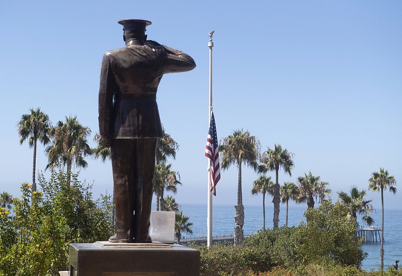 FILE - The U.S. flag was lowered to half-staff at Park Semper Fi in San Clemente, Calif., on Friday, July 31, 2020. Eight troops aboard a landing craft that sank off the Southern California coast during a training exercise are presumed dead, the Marine Corps announced Sunday, Aug. 2, 2020. The Marines said they had called off the search that started late Thursday afternoon when the amphibious assault vehicle sank with seven Marines and one sailor aboard. (Paul Bersebach/The Orange County Register via AP, file)