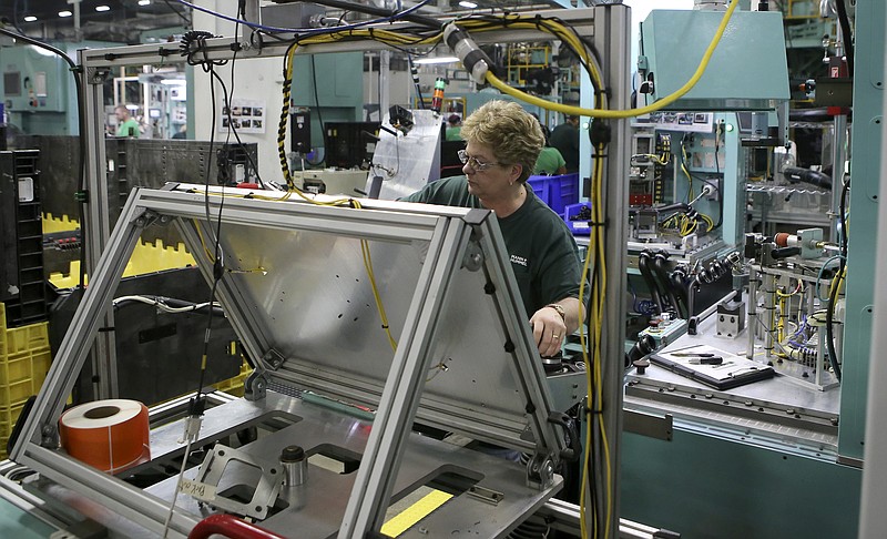 Staff file photo by C.B. Schmelter / An employee works inside the Mann+Hummel auto supplier plant in Dunlap, Tennessee.