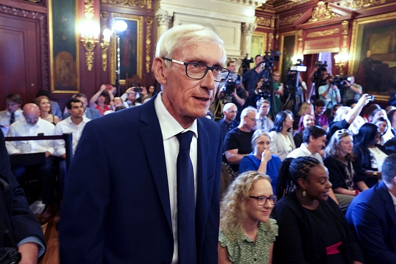 FILE - In this July 3, 2019 file photo, Wisconsin Gov. Tony Evers arrives to signs the budget at the State Capitol in Madison, Wisconsin. Gov. Evers on Monday, Aug. 3, 2020, endorsed Joe Biden for president, a move that comes after Evers declined to endorse anyone in the primary and just two weeks before the start of the Democratic National Convention in Milwaukee. (Steve Apps/Wisconsin State Journal via AP)