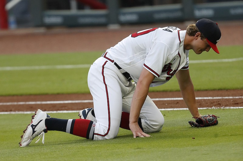 AP photo by John Bazemore / Atlanta Braves starting pitcher Mike Soroka waits for assistance from the training staff after being injured in the third inning of Monday night's home game against the New York Mets.