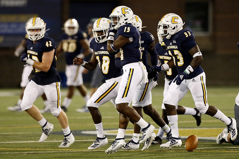 Staff photo by C.B. Schmelter / UTC's Kameron Brown (15) celebrates after picking off a pass against Eastern Illinois on Aug. 29, 2019, at Finley Stadium.