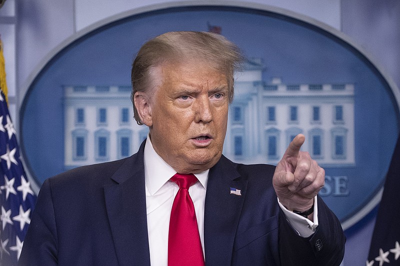 FILE - President Donald Trump points to a question as he speaks during a briefing with reporters in the James Brady Press Briefing Room of the White House, in Washington. Trump's demand that the U.S. government get a cut of Microsoft buying TikTok is the latest unprecedented scenario in an unprecedented situation. Microsoft is in talks to buy parts of TikTok, a forced sale after Trump threatened to ban the Chinese-owned video app, which has one hundred million U.S. users and hundreds of millions globally. (AP Photo/Alex Brandon)


