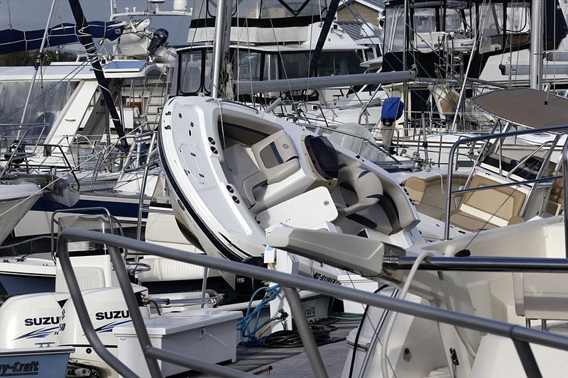 Boats are piled on each other at the Southport Marina following the effects of Hurricane Isaias in Southport, N.C., Tuesday, Aug. 4, 2020. (AP Photo/Gerry Broome)

