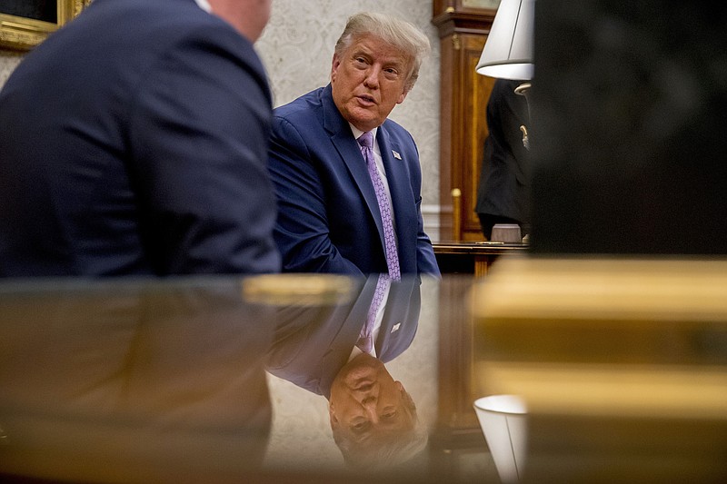 Photo by Andrew Harnik of The Associated Press / President Donald Trump meets with Arizona Gov. Doug Ducey in the Oval Office of the White House in Washington, Wednesday, Aug. 5, 2020.