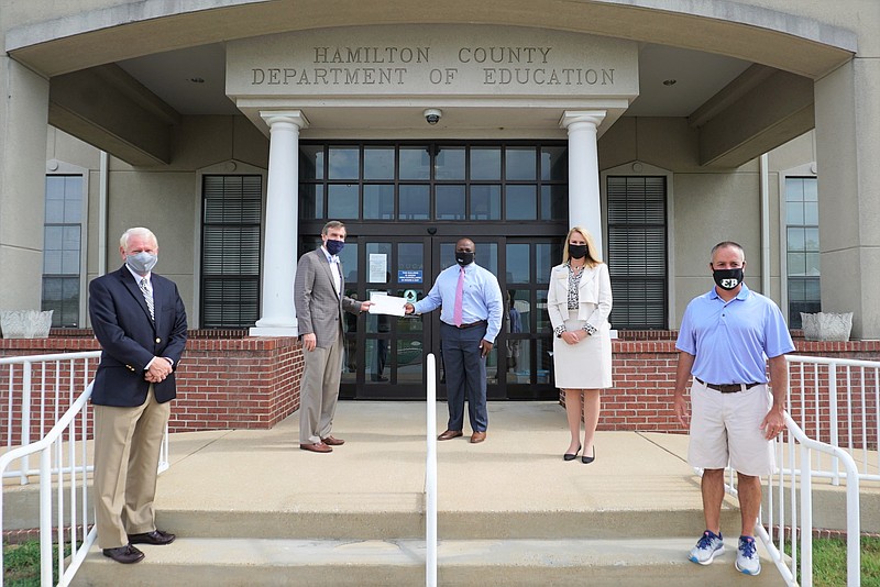 Members of the Bible in the Schools presented Hamilton County Schools Superintendent Bryan Johnson with a check of $1.7 million as reimbursement for the 2019-2020 Bible History elective program. / (Photo courtesy of Bible in the Schools) 