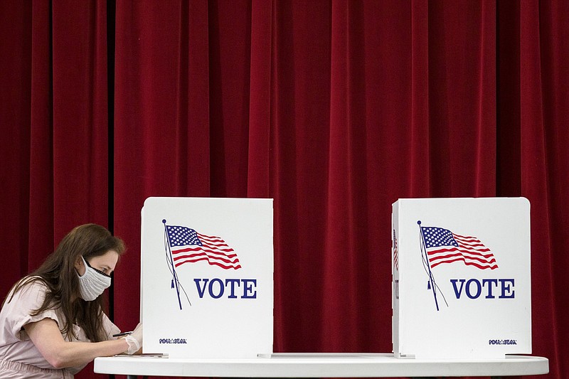 Staff photo by C.B. Schmelter / Elizabeth Snow fills out her ballot at Red Bank Cumberland Presbyterian Church on Thursday, Aug. 6, 2020, in Red Bank, Tenn.