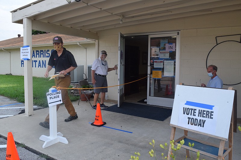 Staff photo by Ben Benton / Masked voter Rusty Packard leaves the polling place for Harrison precincts 1, 2 and 6 at the Harrison Ruritan Club on Highway 58 after casting his ballot on Thursday, Aug. 6, 2020.