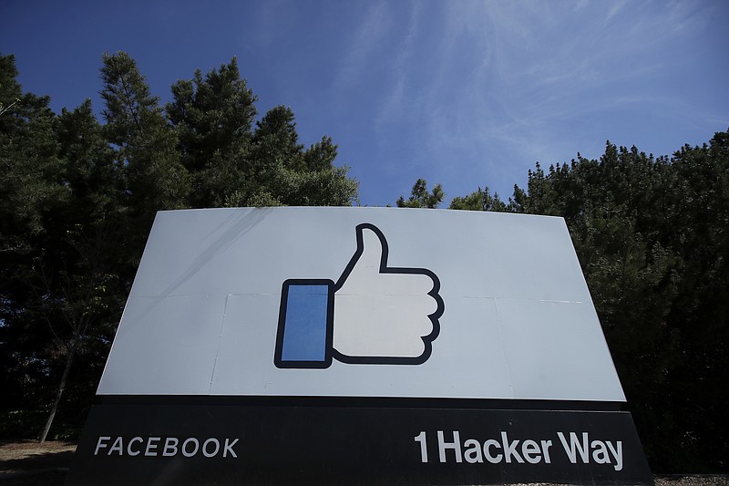 The thumbs up Like logo is shown on a sign at Facebook headquarters in Menlo Park, Calif., Tuesday, April 14, 2020. Facebook has deleted a post by President Donald Trump for the first time, saying it violated its policy against spreading misinformation about the coronavirus. The post in question featured a link to a Fox News video in which Trump says children are "virtually immune" to the virus. Facebook said Wednesday, Aug. 5, 2020 that the "video includes false claims that a group of people is immune from COVID-19 which is a violation of our policies around harmful COVID misinformation." (AP Photo/Jeff Chiu)


