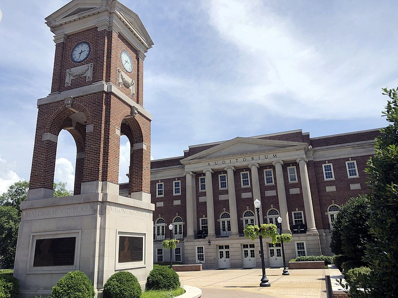 In this June 16, 2019 file photo, the Autherine Lucy Clock Tower at the Malone Hood Plaza stands in front of Foster Auditorium on the University of Alabama campus in Tuscaloosa, Ala. The university has decided to remove from an academic building the name of a white doctor who misused medical evidence to support slavery, according to school officials. The system's board of trustees voted unanimously on Wednesday, Aug. 5, 2020, to strip the name of Dr. Josiah Nott from the campus facility which houses the Honors College, labs and offices, and replace it with Honors Hall, news outlets reported.(AP Photo/Bill Sikes, File)