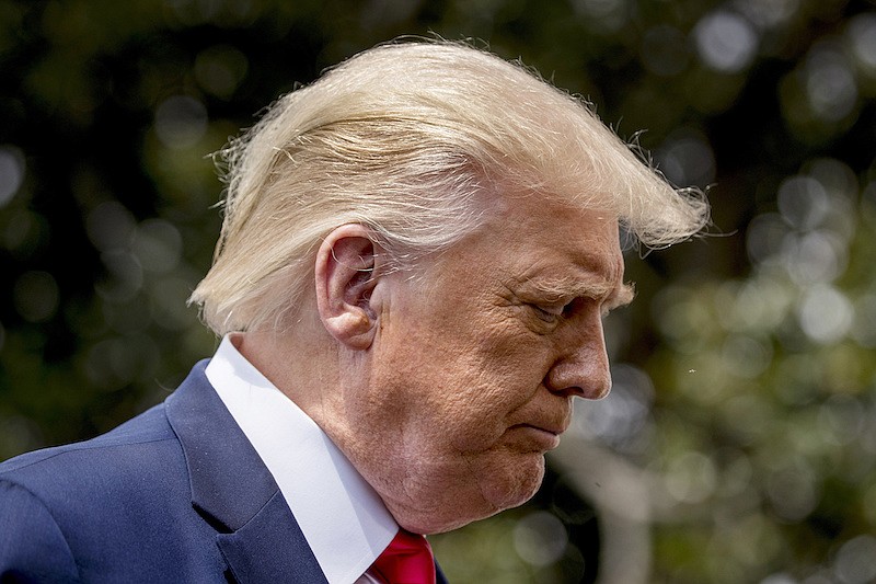 President Donald Trump pauses while speaking with members of the media before boarding Marine One on the South Lawn of the White House in Washington, Thursday, Aug. 6, 2020, for a short trip to Andrews Air Force Base, Md. and then on to Cleveland, Ohio. (AP Photo/Andrew Harnik)