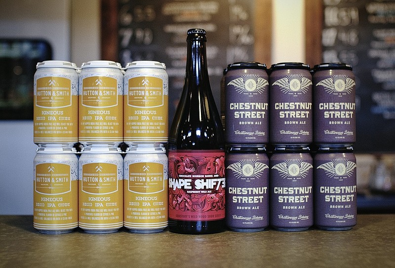 Pictured above is the Hutton & Smith Brewing Co. Igneous IPA, OddStory Brewing Company Shapeshifter and Chattanooga Brewing Co. Chestnut Street Brown Ale. All can be purchased at Imbibe Wine & Spirits to celebrate International Beer Day on Friday, Aug. 7, or at any point this summer to celebrate local craft brewers and their creations. Photo provided by Imbibe Wine & Spirits. 