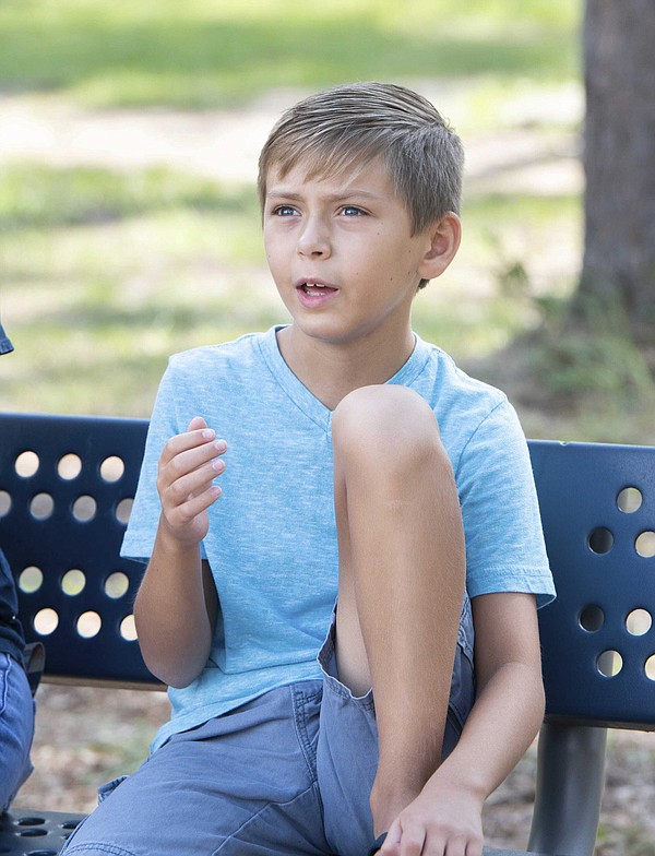 Man fractures neck in diving accident; young son saves him