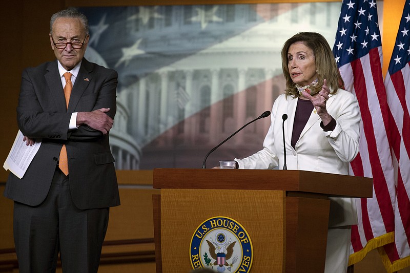House Speaker Nancy Pelosi of Calif., joined by Senate Minority Leader Sen. Chuck Schumer of N.Y., speaks during a news conference on Capitol Hill in Washington, Thursday, Aug. 6, 2020. (AP Photo/Jose Luis Magana)